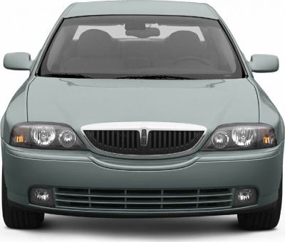 Front view of sedan with distinctive grille, headlights, and fog lamps