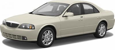 Front side view of a luxury mid-size sedan with smooth body lines and detailed headlight design