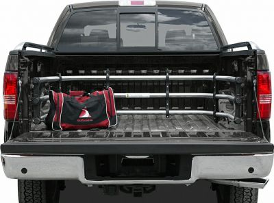 Truck bed with cargo divider and gear bag in rear section