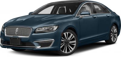 Front-side view of luxury sedan with distinctive grille and LED headlights