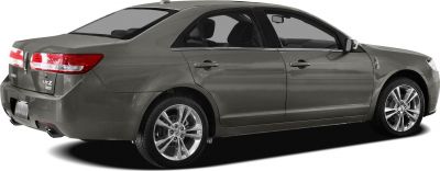Sleek rear side view of a sedan with alloy wheels.