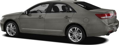Side and rear view of mid-size sedan with distinctive taillights and chrome wheels