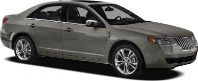 Front-side view of a sedan with chrome grille and alloy wheels