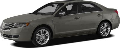 Front side view of sedan with chrome grille and polished alloy wheels