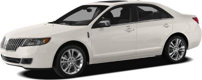 Luxury sedan with chrome grille and alloy wheels, side front view
