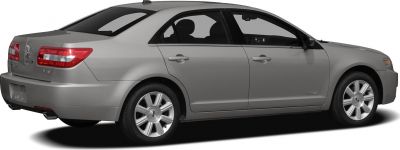 Rear side view of a silver four-door sedan with distinct taillights and alloy wheels