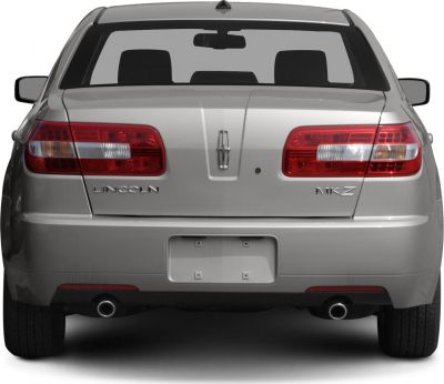 Rear view with dual exhaust pipes and distinct tail lights