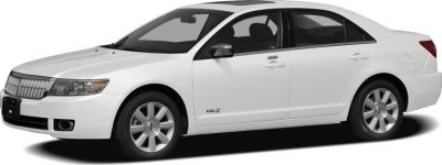 White sedan with alloy wheels showing side profile