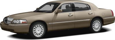 Side profile of beige luxury sedan with chrome trim and multi-spoke rims
