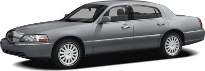 Side view of a luxury sedan with polished alloy wheels and chrome trim