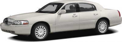 Classic luxury sedan side profile with chrome grille and alloy wheels