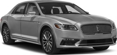Front-side view with signature grille and sleek alloy wheels