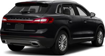 SUV rear view with LED taillights and chrome dual exhausts