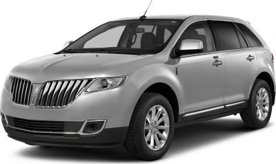 Silver SUV with prominent chrome grille and alloy wheels, front-side profile