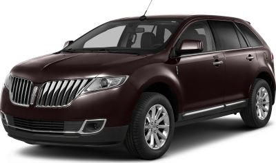 Front side view of luxury SUV with chrome grille and modern headlights