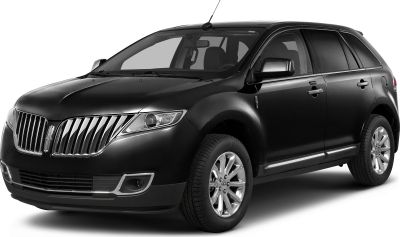Chrome vertical grille and sleek headlight design on midsize SUV