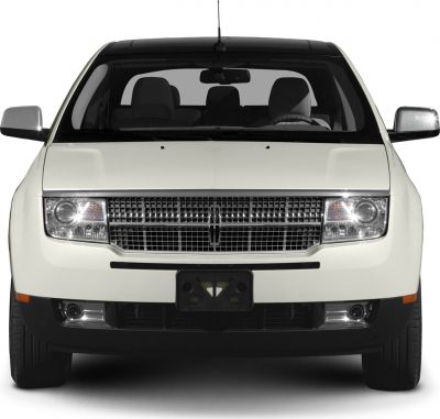 Front view with distinctive grille, headlights, and fog lights.