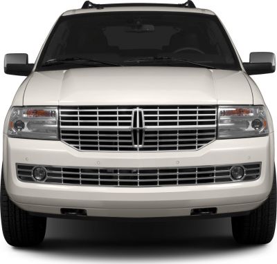 Front grill and dual headlights with fog lights of a luxury SUV
