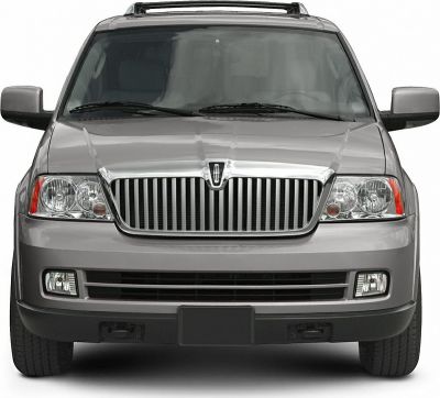 Luxury SUV front with chrome vertical grille and dual headlights