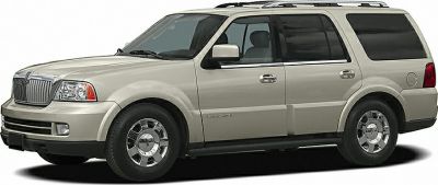 Side view of a robust luxury SUV with chrome wheels and roof rails
