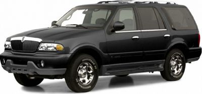 Black large SUV with chrome wheels front side view