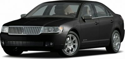Front grille and chrome alloy wheels on black luxury sedan