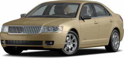 Front and side view of sedan with chrome wheels and vertical grille