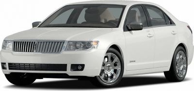 Front forward angle of a luxury sedan with chrome grille and alloy wheels