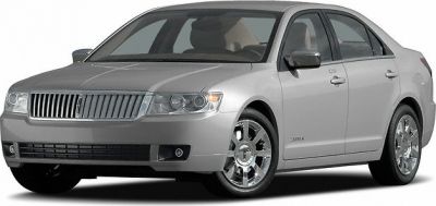 Silver sedan with chrome wheels and a vertical grille