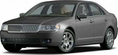 Front grille and chrome alloy wheels of a luxury sedan