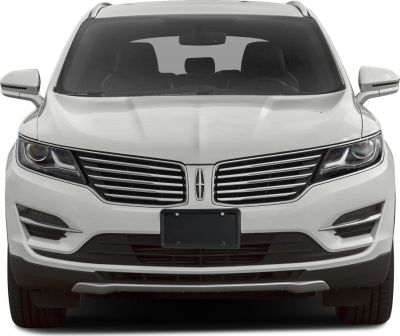 Front grille and LED headlights of a white SUV
