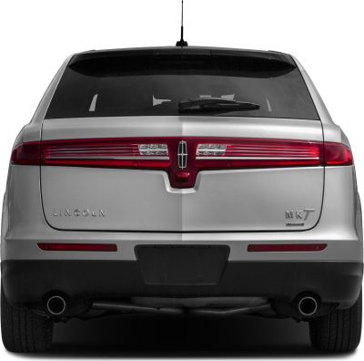 Rear view featuring full-width taillights and dual exhaust system