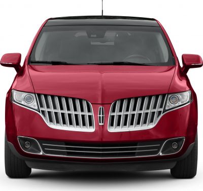 Front view with vertical slat grille and sleek headlights
