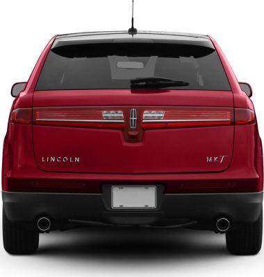 Rear view with horizontal tail lights and dual exhaust pipes