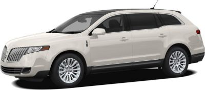 White luxury SUV side profile with chrome grille and elongated body