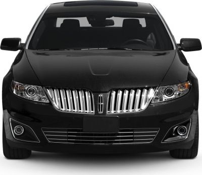 Front view with vertical chrome grille and modern headlights.