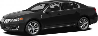 Side profile of luxury sedan with chrome grille and alloy wheels