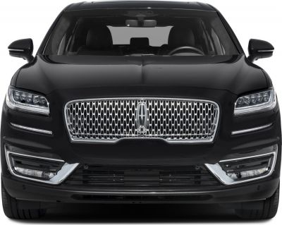 Front view showing distinctive grille and LED headlights