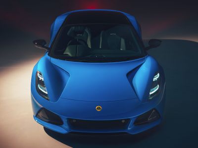 Blue sports car front with LED headlights and sculpted hood
