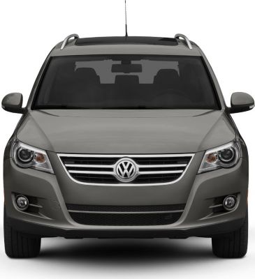 Front view with distinctive grille, headlights, and roof rails