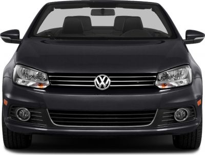 Front view of convertible with headlights, grille, and windshield