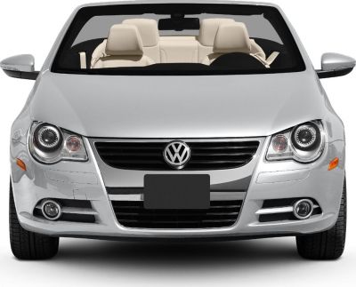 Front view of a convertible with headlights and beige interior seats