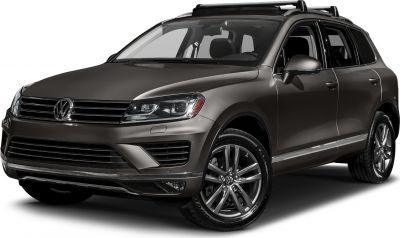 Front-side view of SUV with alloy wheels and roof rack.