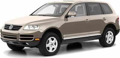 Front side view of a beige mid-size SUV with alloy wheels