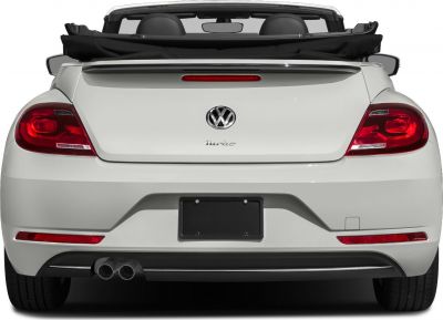 Rear view with dual exhaust and retracted soft top