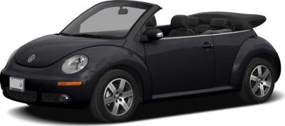 Black Volkswagen convertible with soft top roof and rounded design