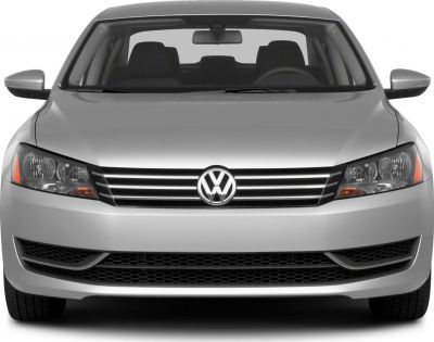 Front view with prominent grille, headlights, and side mirrors.