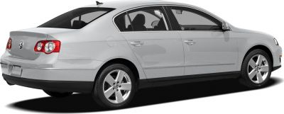 Silver mid-size sedan with distinct rear tail lights and alloy wheels