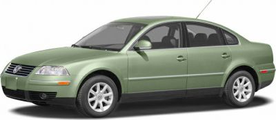 Mid-2000s four-door sedan, green paint, alloy wheels.
