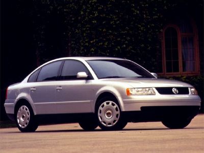 Silver four-door sedan with classic clean lines.